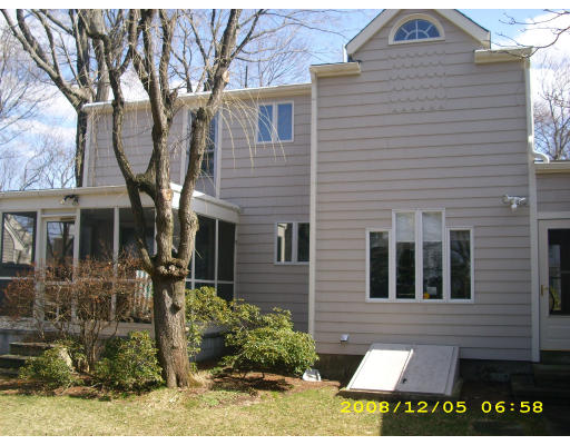 27 Philbrick Road Newton, MA 02459 - Photo 3 of 17 a view of a brick house with large windows and a large tree