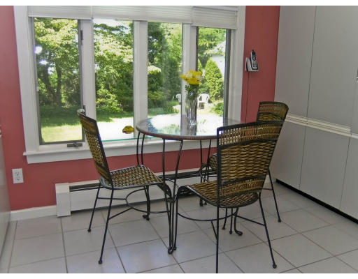 27 Philbrick Road Newton, MA 02459 - Photo 6 of 17 a dining room with furniture and a floor to ceiling window