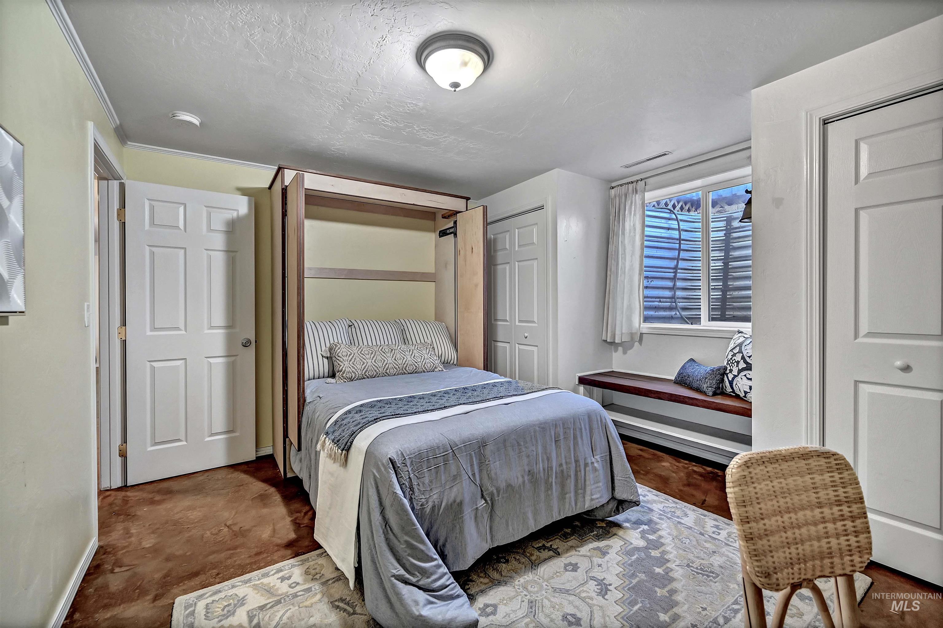 1902 West Washington Street Boise, ID 83702 - Photo 27 of 43 Bedroom featuring two closets and a textured ceiling