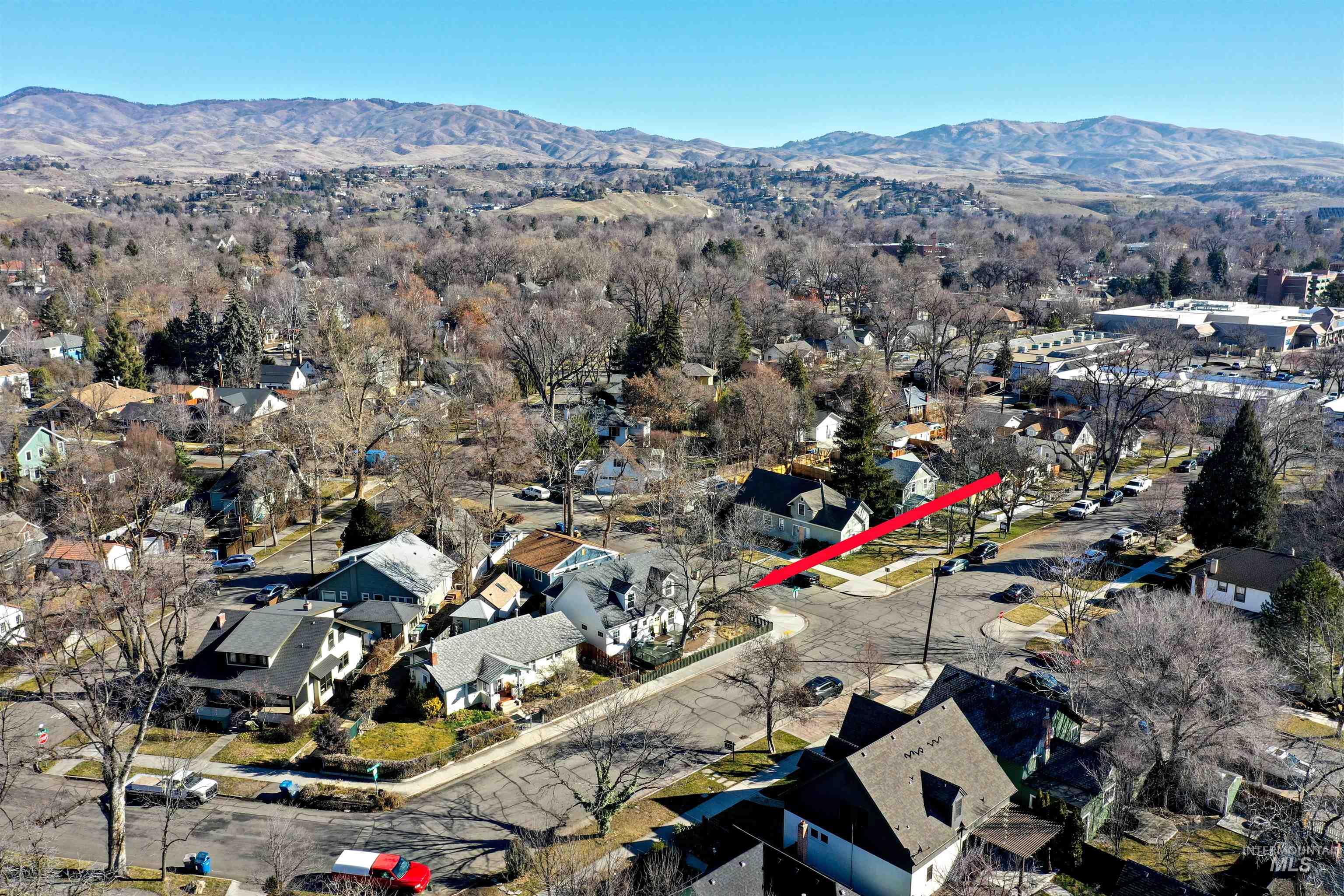 1902 West Washington Street Boise, ID 83702 - Photo 38 of 43 Aerial view of property and surrounding area featuring a mountain backdrop and nearby suburban area