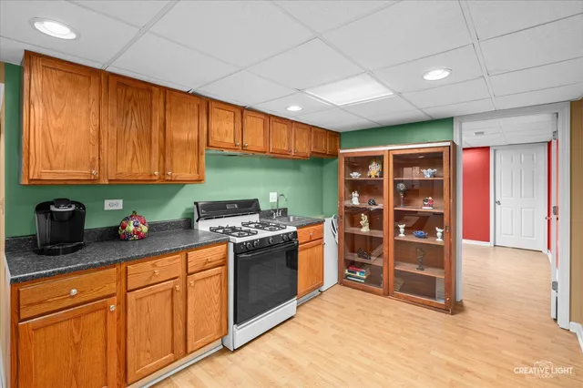 a kitchen with stainless steel appliances granite countertop a stove and a sink