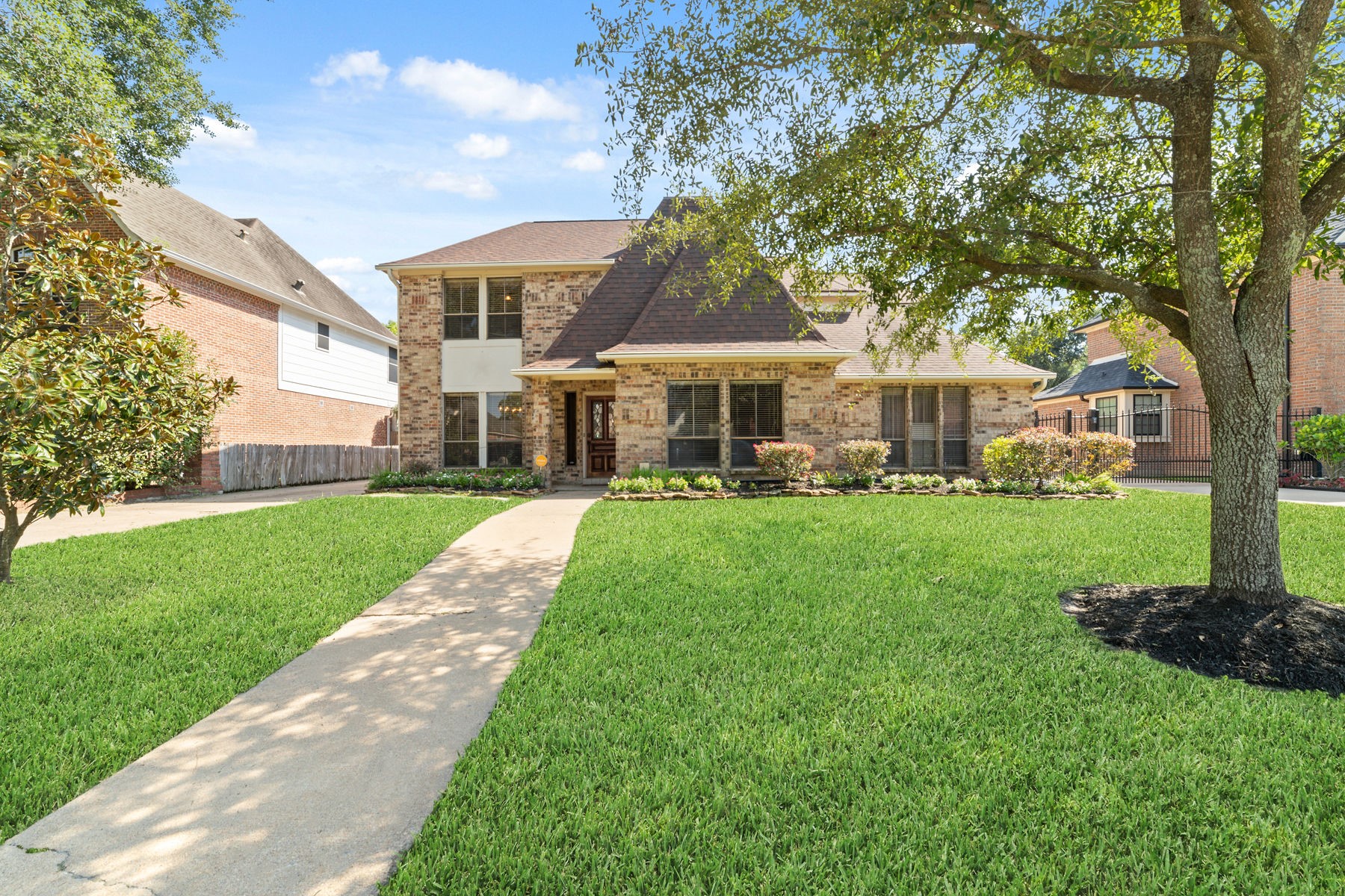 a front view of a house with a yard table and chairs