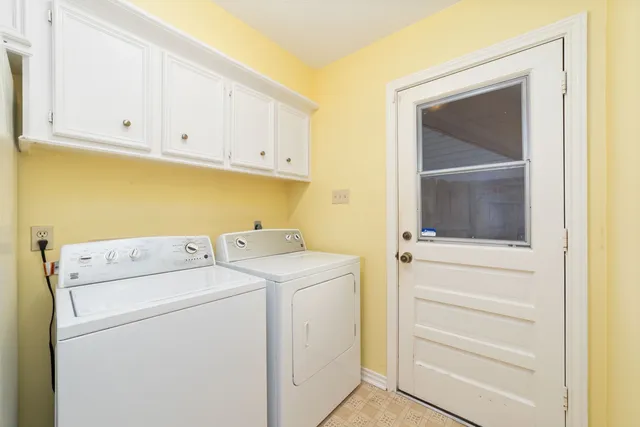 a view of storage and utility room with washer and dryer