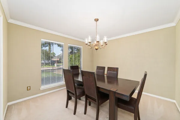 a view of a dining room with furniture window and outside view