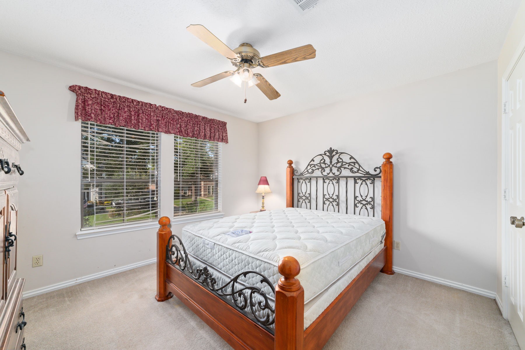 14931 Inverrary Drive Houston, TX 77095 - Photo 32 of 33 a bed sitting in a bedroom next to a window