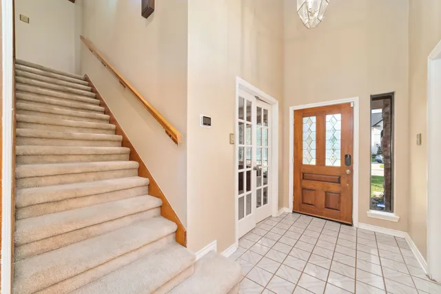 a view of entryway and hall with a couch