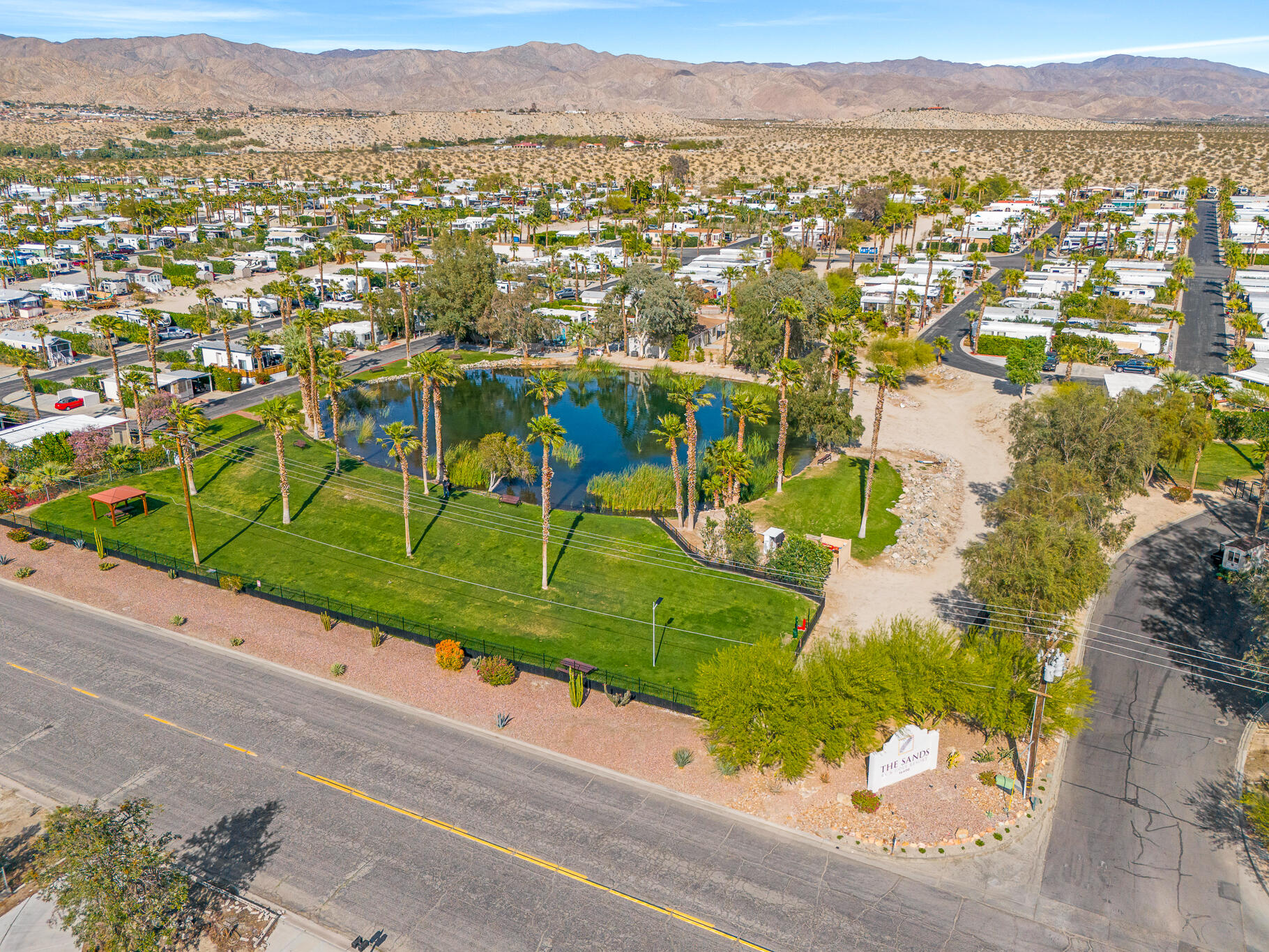 16400 Bubbling Wells Road, Unit 95 Desert Hot Springs, CA 92240 - Photo 18 of 21 an aerial view of residential houses with outdoor space
