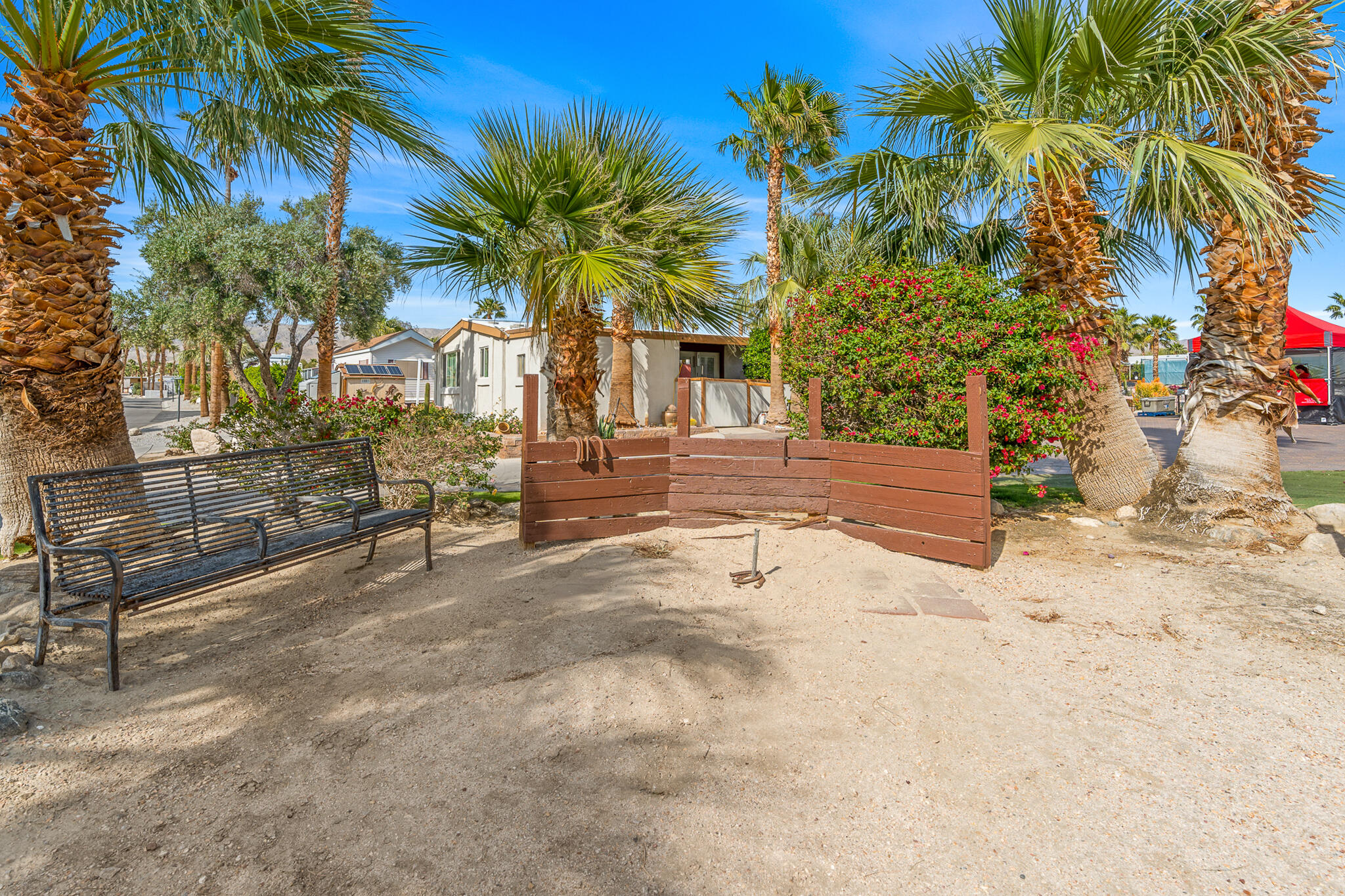 16400 Bubbling Wells Road, Unit 95 Desert Hot Springs, CA 92240 - Photo 20 of 21 a view of a house with a yard