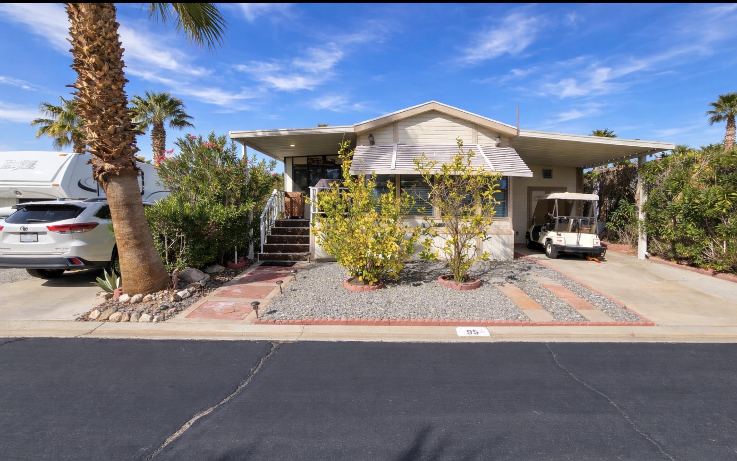 16400 Bubbling Wells Road, Unit 95 Desert Hot Springs, CA 92240 - Photo 2 of 21 a view of a house with a street