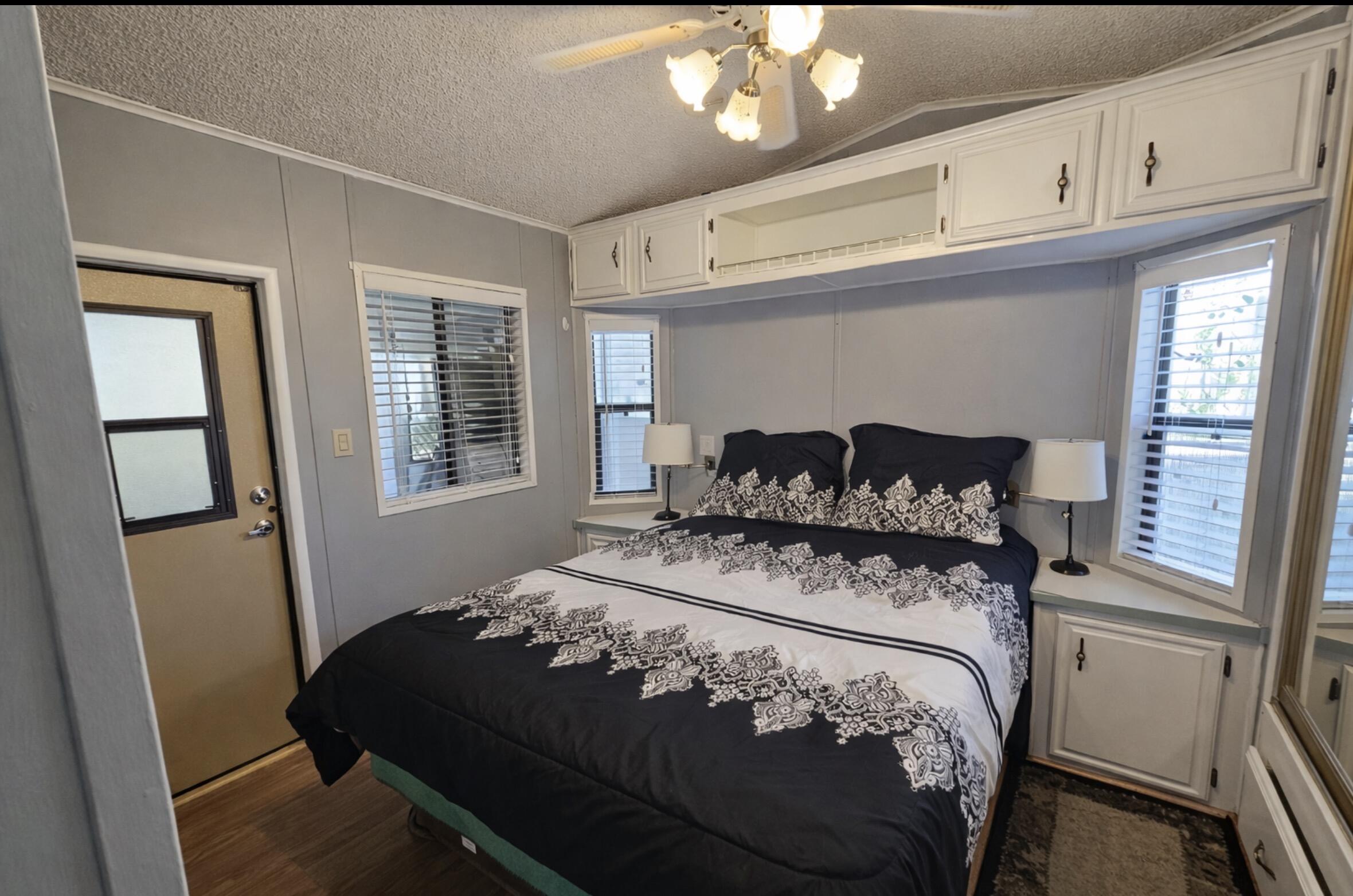 16400 Bubbling Wells Road, Unit 95 Desert Hot Springs, CA 92240 - Photo 6 of 21 a bedroom with a bed and window