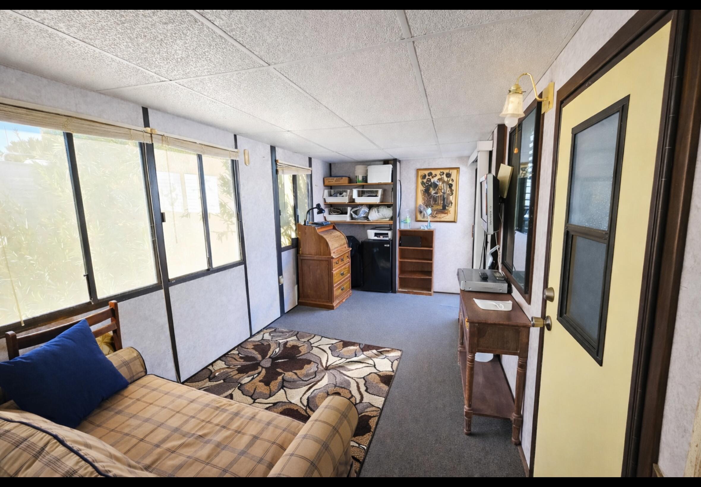 16400 Bubbling Wells Road, Unit 95 Desert Hot Springs, CA 92240 - Photo 8 of 21 a bedroom with a bed closet and a large window