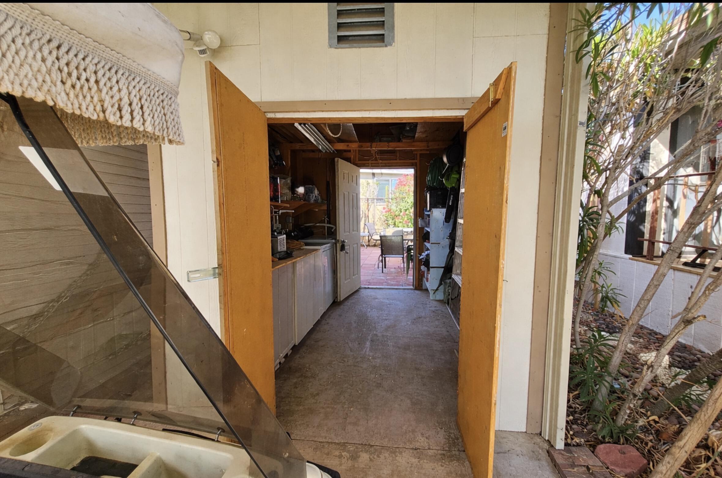 16400 Bubbling Wells Road, Unit 95 Desert Hot Springs, CA 92240 - Photo 9 of 21 a view of a hallway with wooden floor and living room