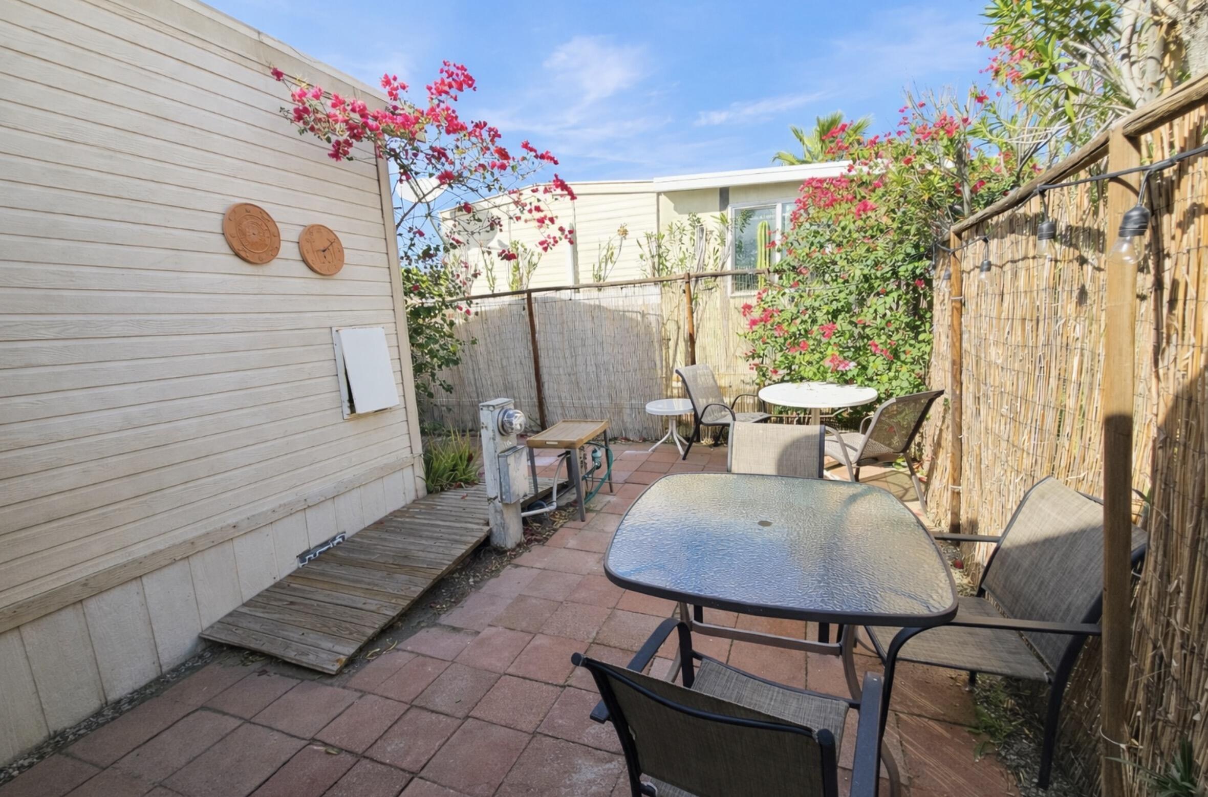 16400 Bubbling Wells Road, Unit 95 Desert Hot Springs, CA 92240 - Photo 10 of 21 a view of a chairs and tables in the patio