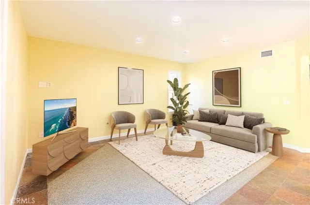 a living room with furniture and a table