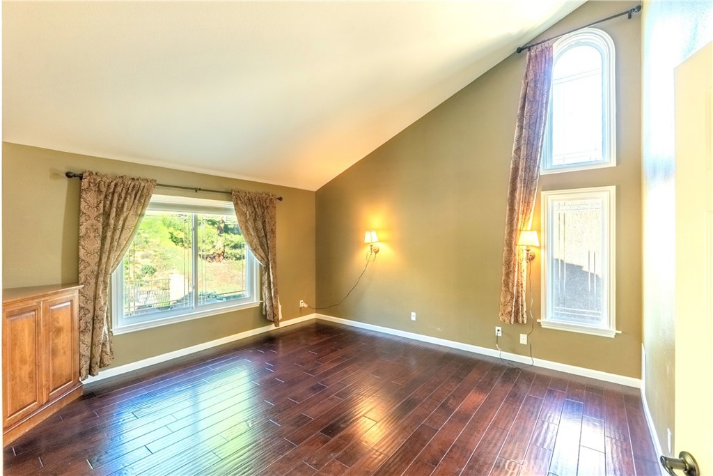 20549 Romar Lane Saugus, CA 91350 - Photo 20 of 31 an empty room with wooden floor and windows