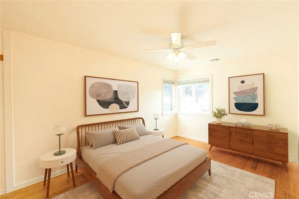 20549 Romar Lane Saugus, CA 91350 - Photo 27 of 31 a bedroom with a bed and a chandelier