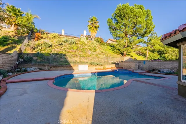 a view of a patio with table and chairs potted plants