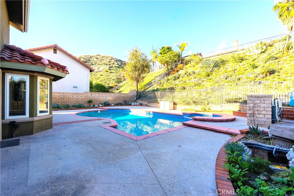 20549 Romar Lane Saugus, CA 91350 - Photo 31 of 31 a view of a patio with table and chairs potted plants