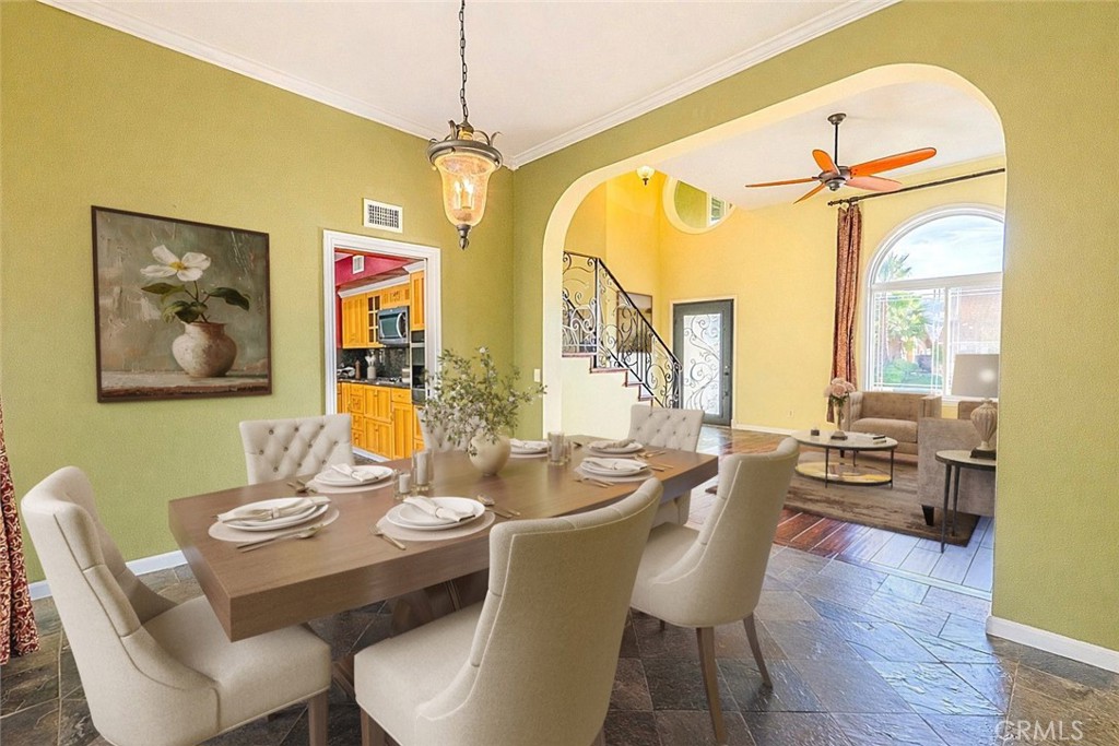 20549 Romar Lane Saugus, CA 91350 - Photo 9 of 31 a dining room with furniture a chandelier and wooden floor