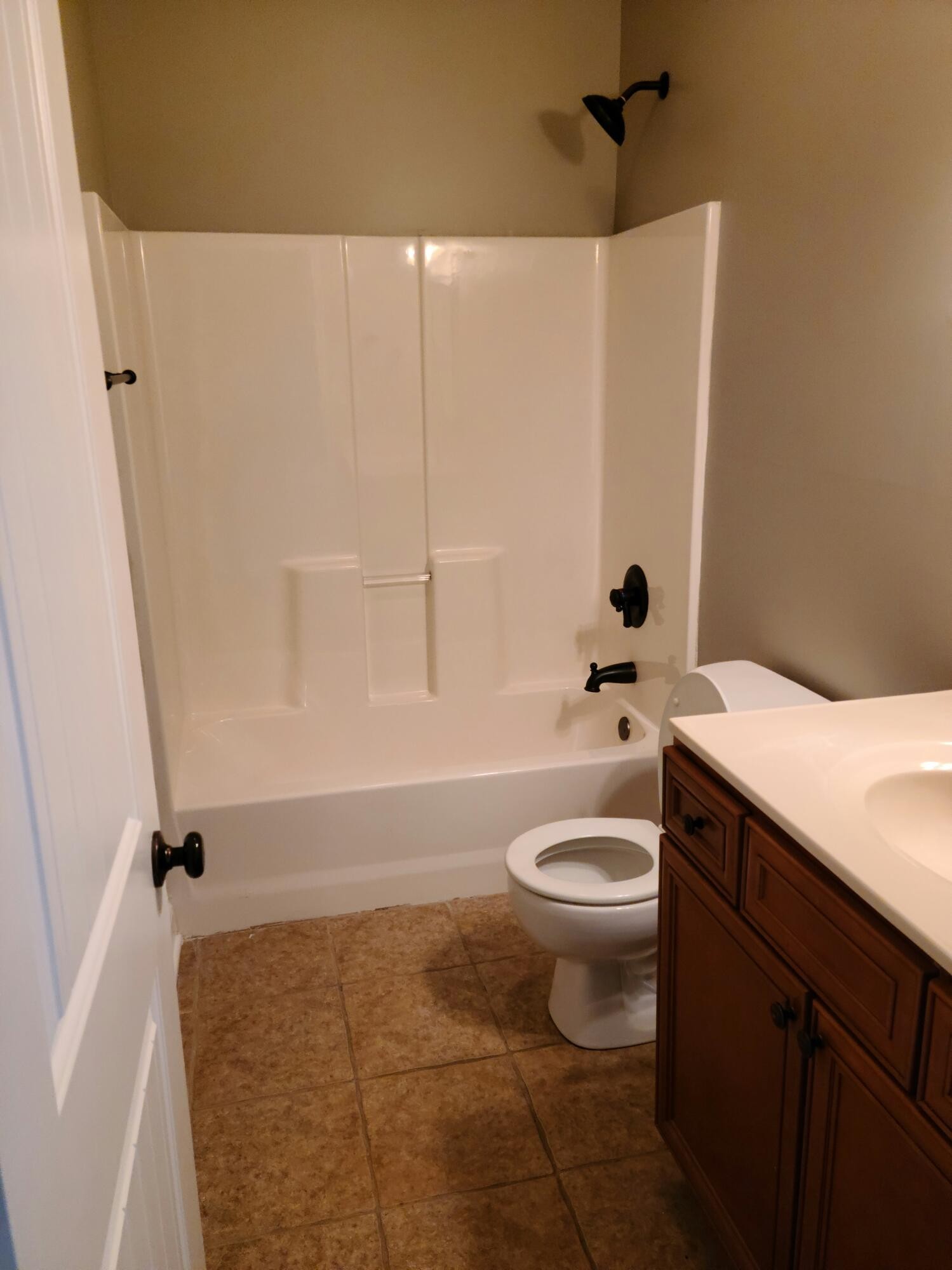 6092 Whisper Ridge Lane Corryton, TN 37721 - Photo 17 of 17 a bathroom with a sink a toilet and shower