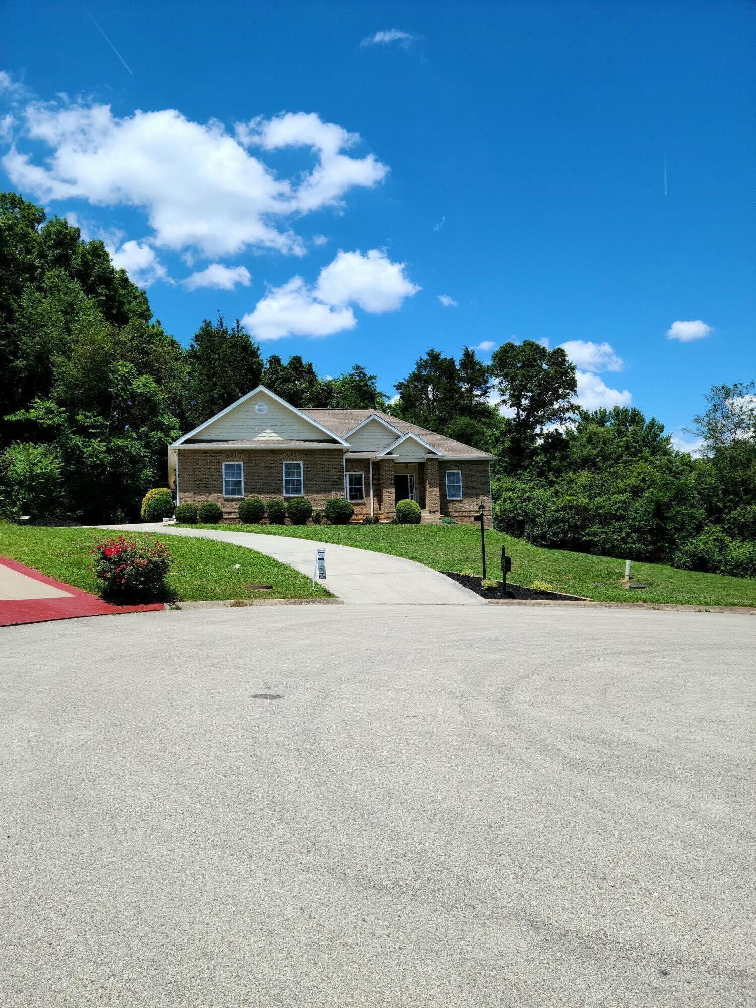 6092 Whisper Ridge Lane Corryton, TN 37721 - Photo 2 of 17 a view of house with outdoor space and street view
