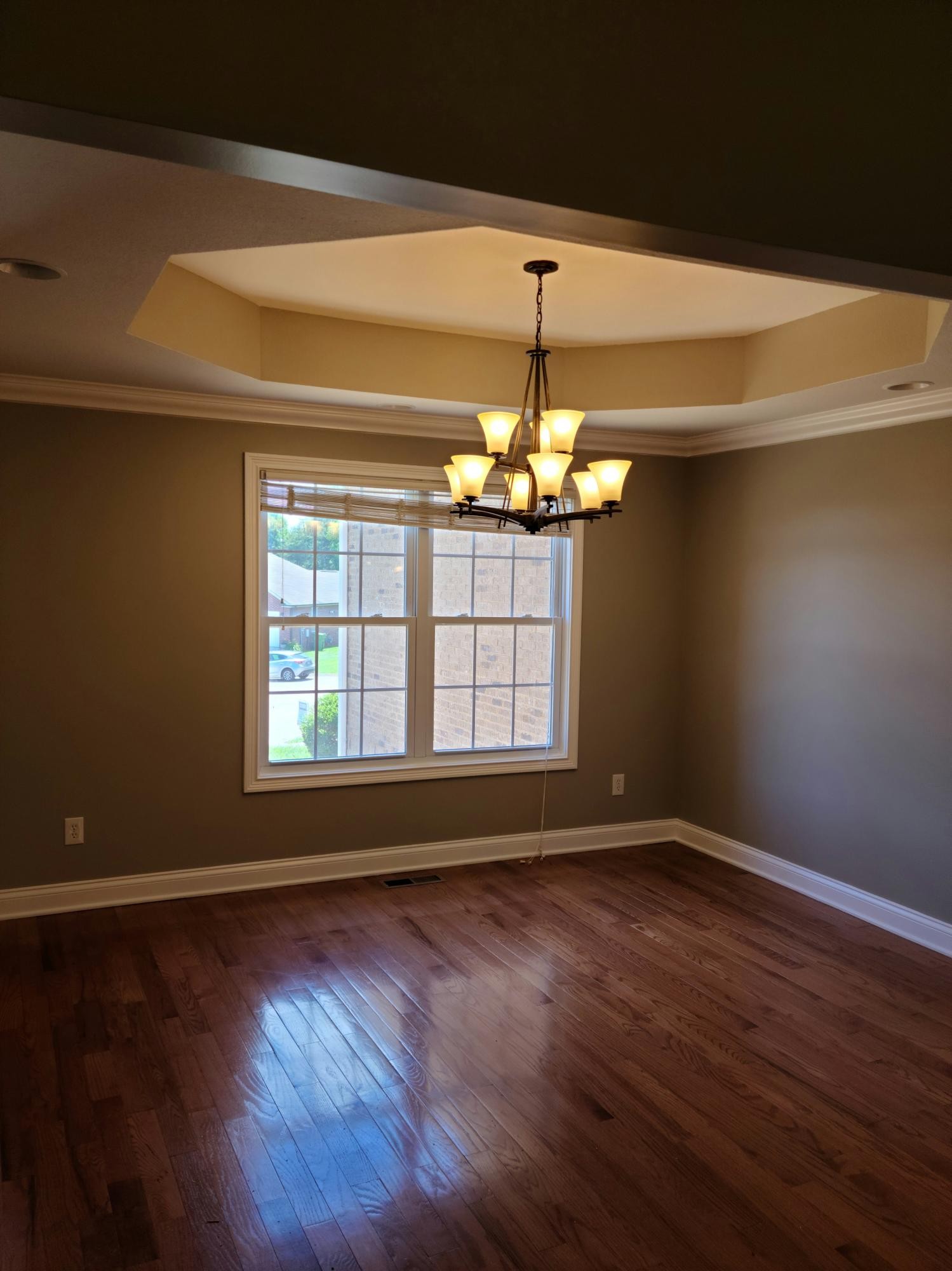 6092 Whisper Ridge Lane Corryton, TN 37721 - Photo 5 of 17 a view of wooden floor chandelier and window in a room