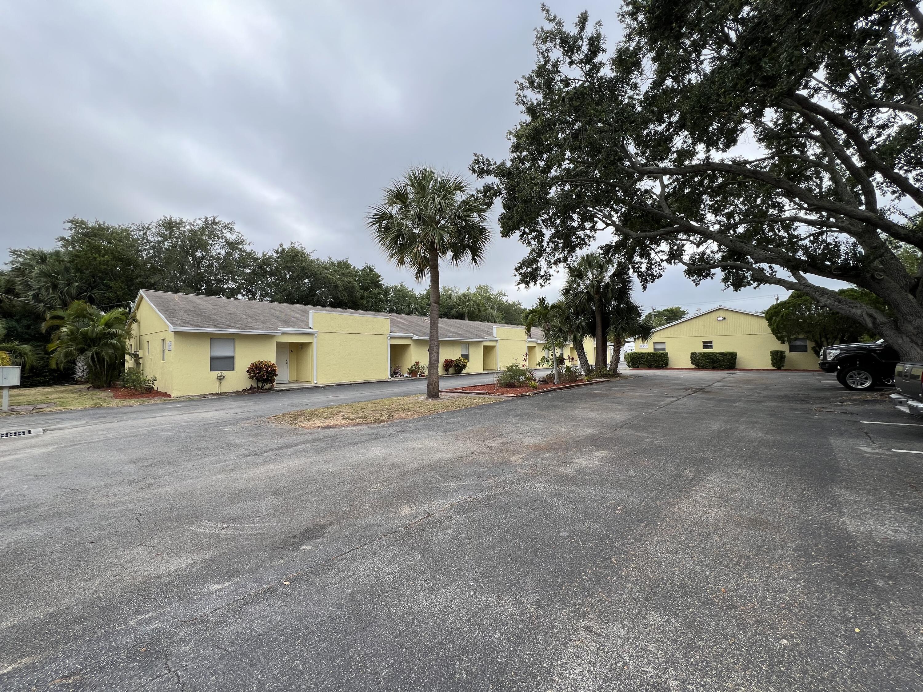 17345 Bush Road, Unit D Jupiter, FL 33458 - Photo 1 of 27 a view of street with parked cars
