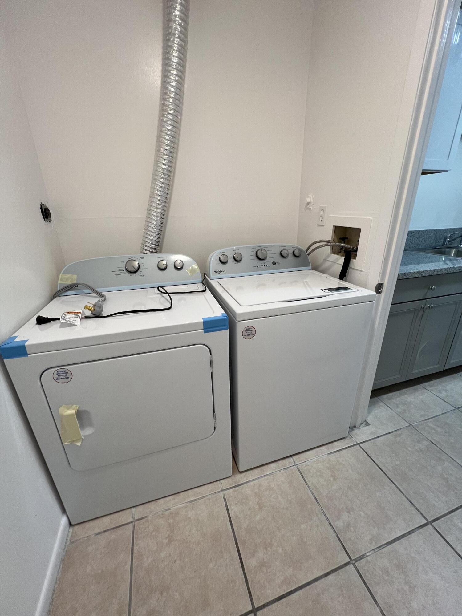 17345 Bush Road, Unit D Jupiter, FL 33458 - Photo 14 of 27 a utility room with dryer and washer