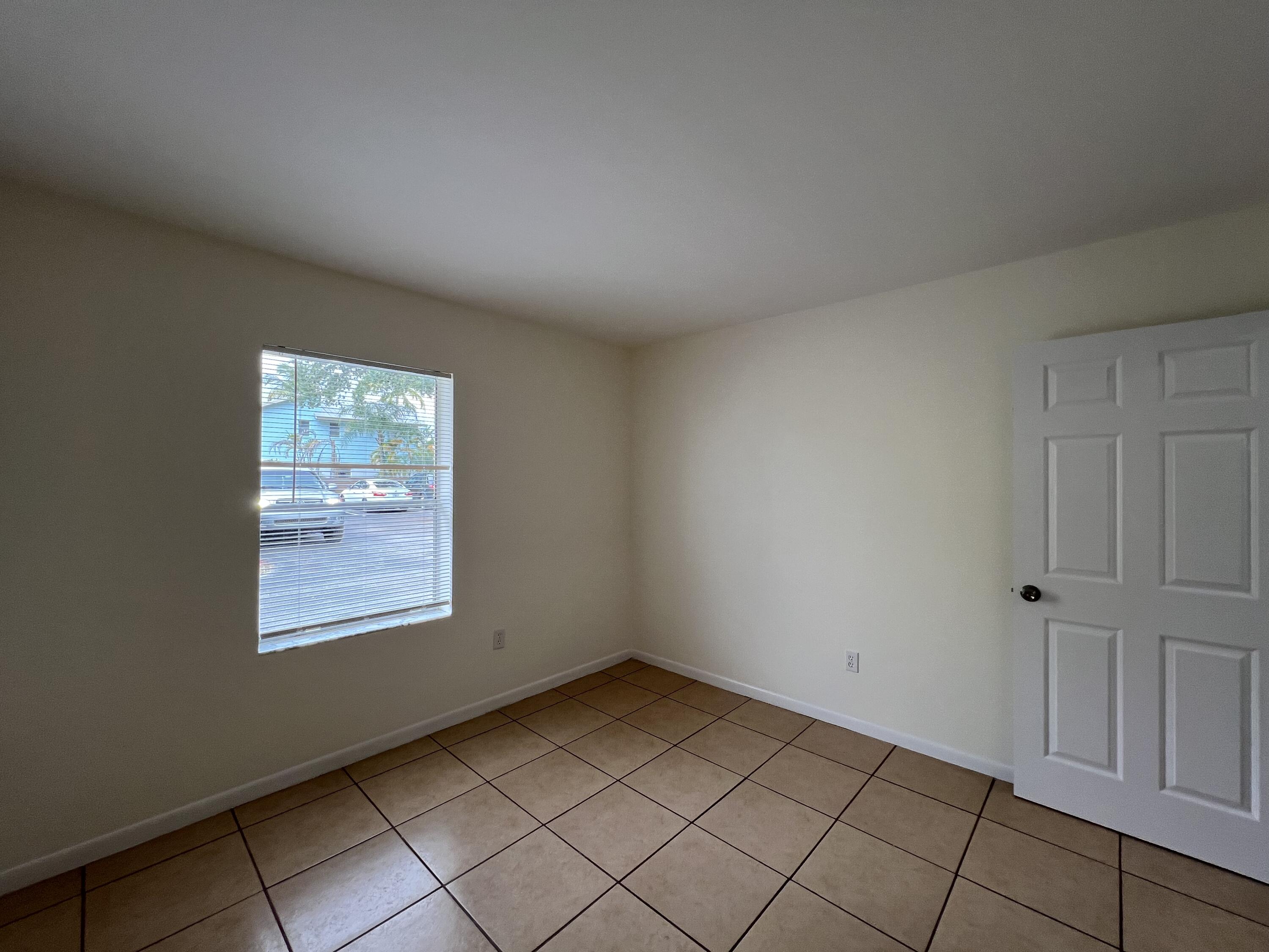 17345 Bush Road, Unit D Jupiter, FL 33458 - Photo 24 of 27 an empty room with windows