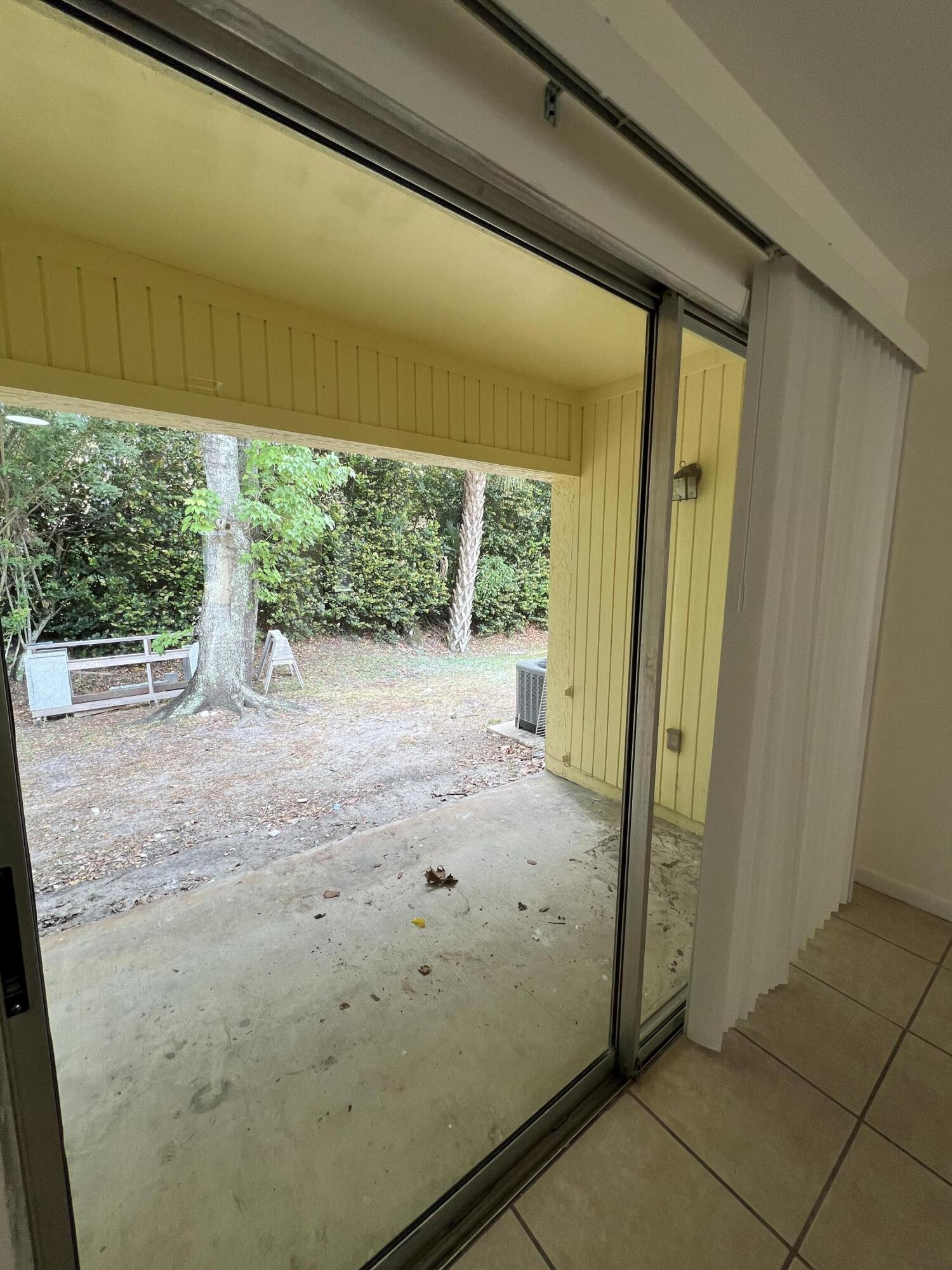 17345 Bush Road, Unit D Jupiter, FL 33458 - Photo 26 of 27 a view of a back yard from a room