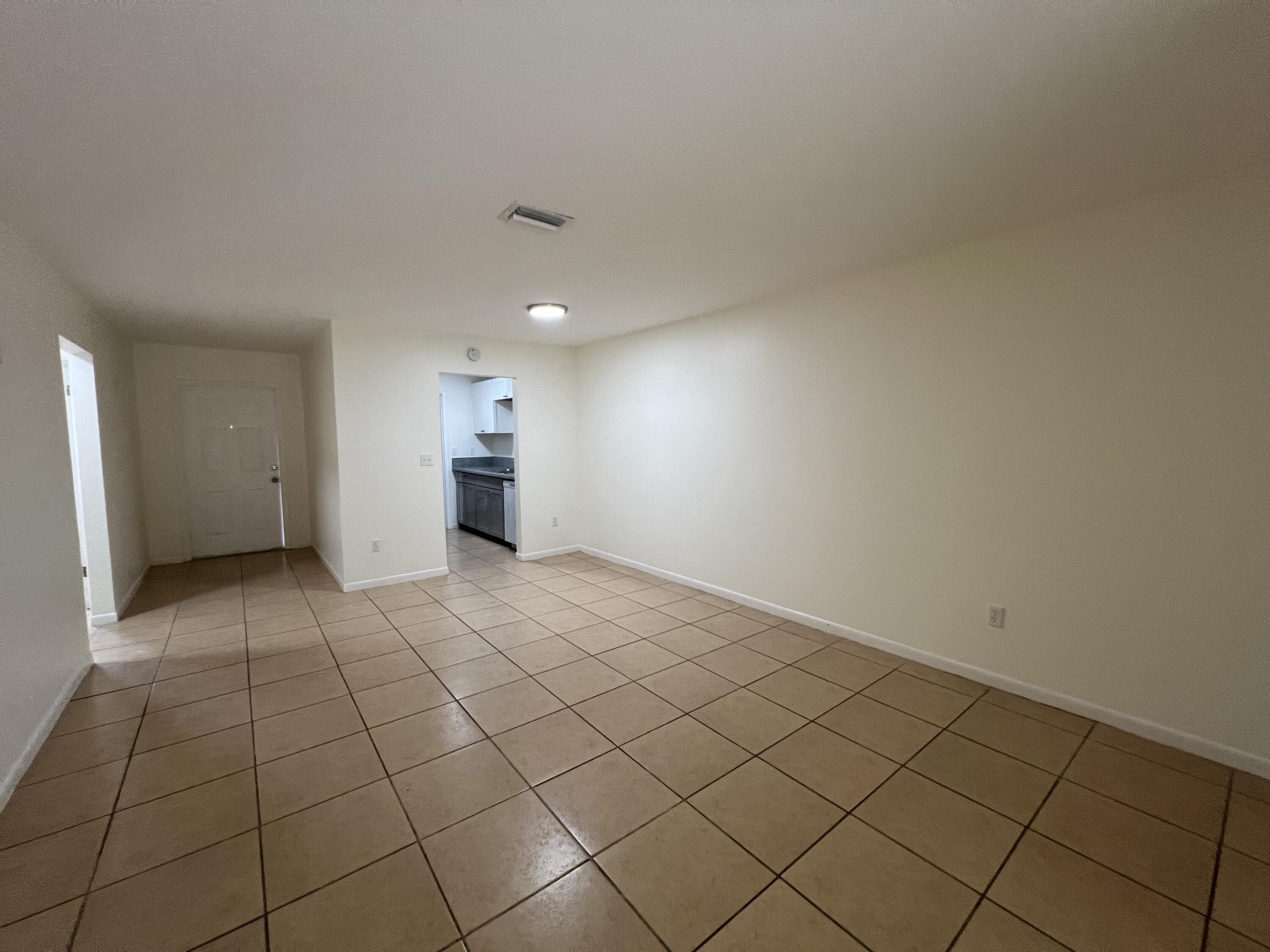 17345 Bush Road, Unit D Jupiter, FL 33458 - Photo 8 of 27 a view of empty room with wooden floor