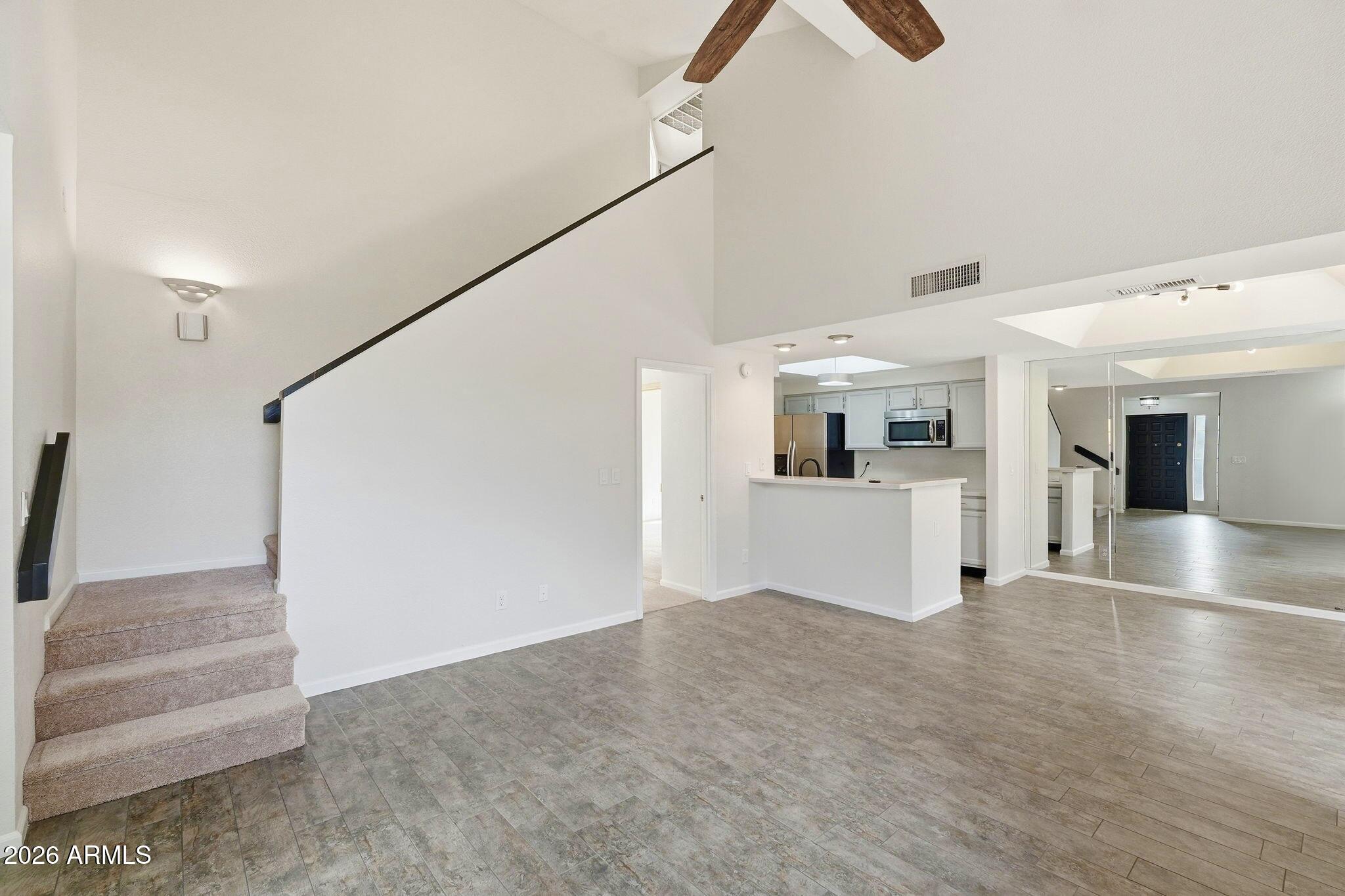 5640 East Bell Road Scottsdale, AZ 85254 - Photo 6 of 26 a view of a big room with closet and windows