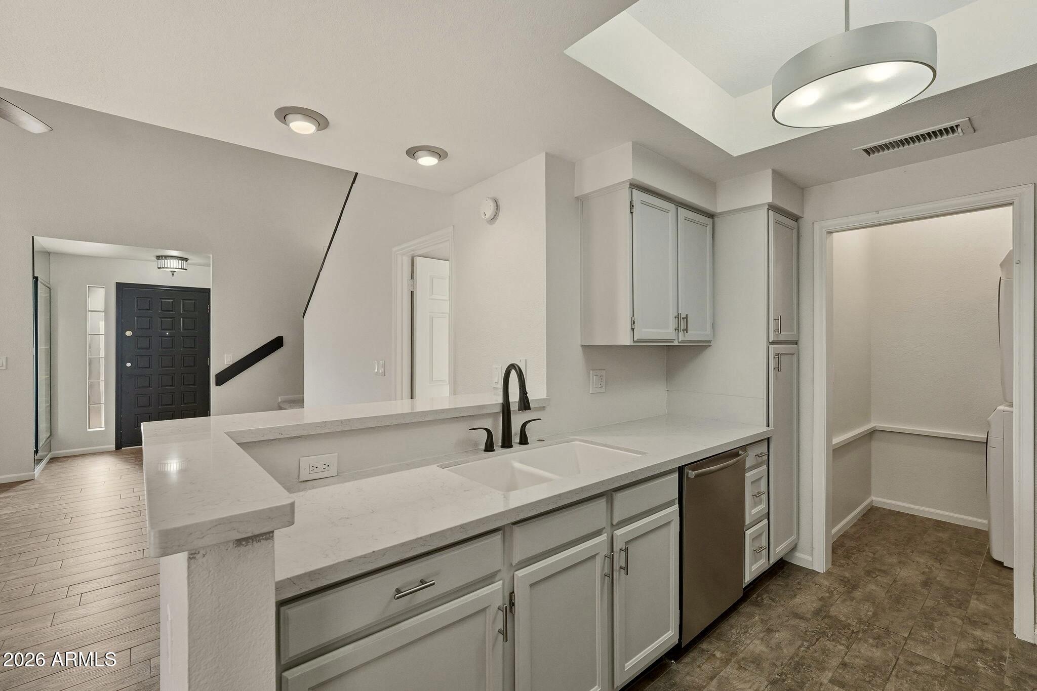 5640 East Bell Road Scottsdale, AZ 85254 - Photo 8 of 26 a kitchen with a sink and cabinets