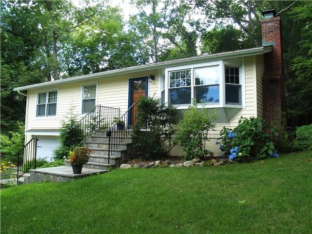 5 Olmstead Road Redding, CT 06896 - Photo 1 of 1 a front view of a house with a garden
