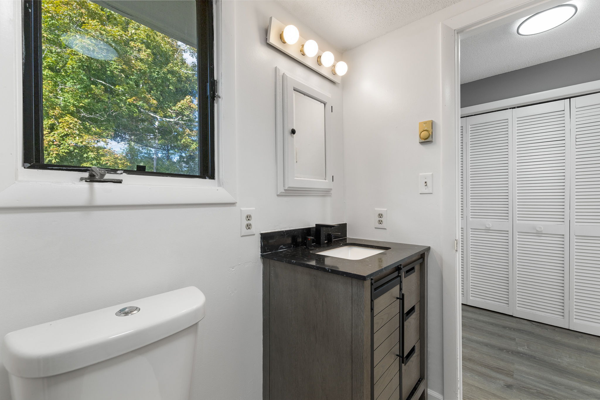 8 Burma Road Southbury, CT 06488 - Photo 13 of 23 a bathroom with a sink a toilet and a mirror