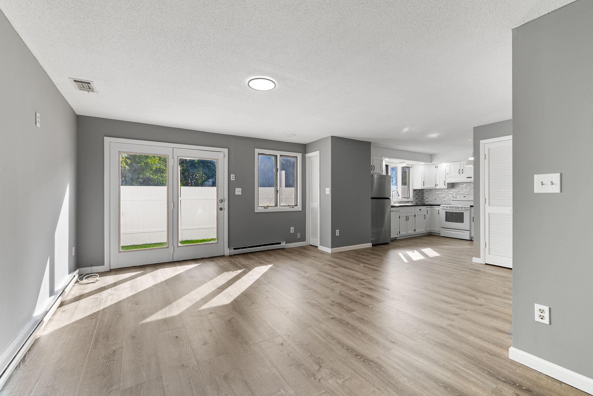 8 Burma Road Southbury, CT 06488 - Photo 14 of 23 a view of a big room with wooden floor and windows