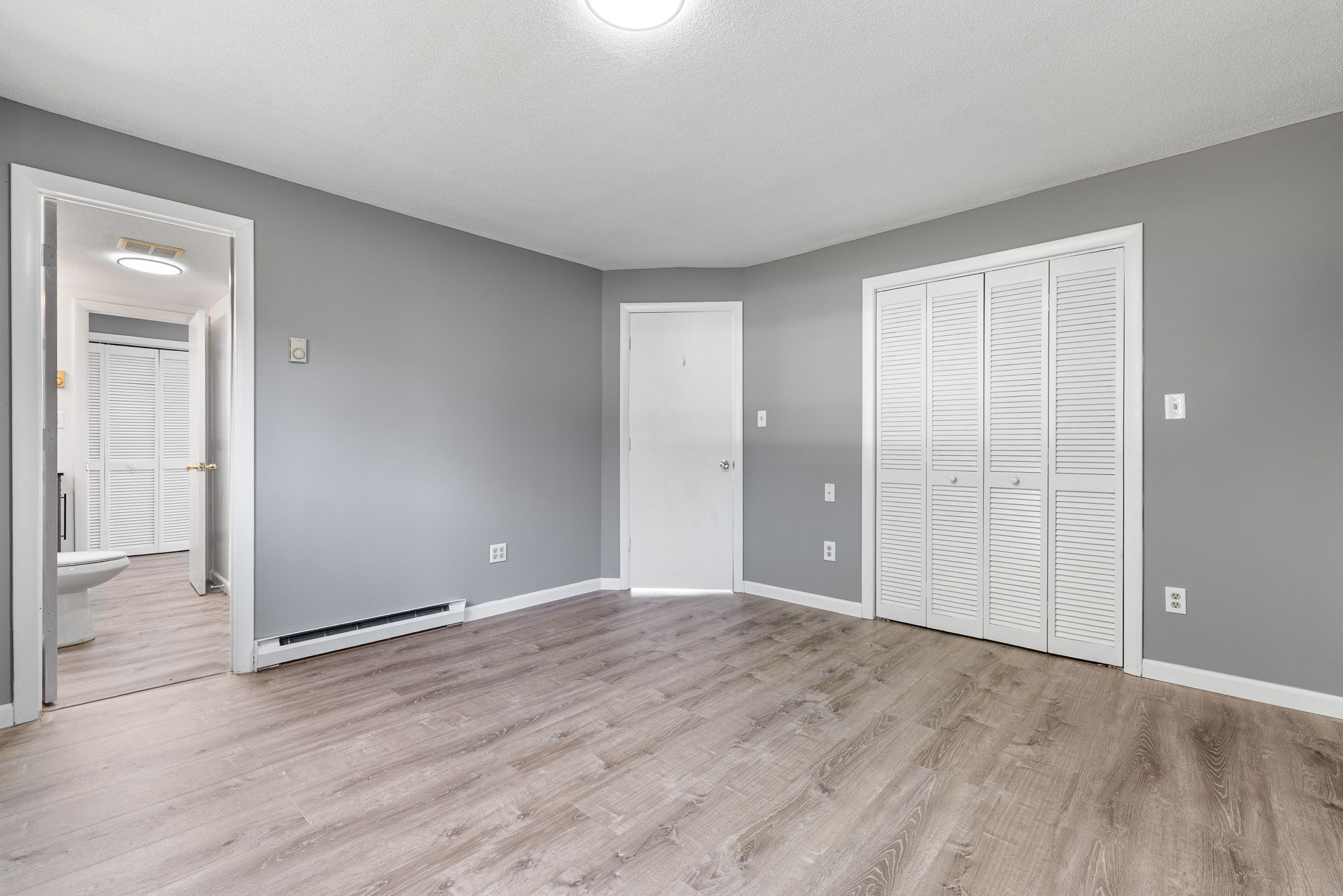 8 Burma Road Southbury, CT 06488 - Photo 18 of 23 a view of an empty room with wooden floor