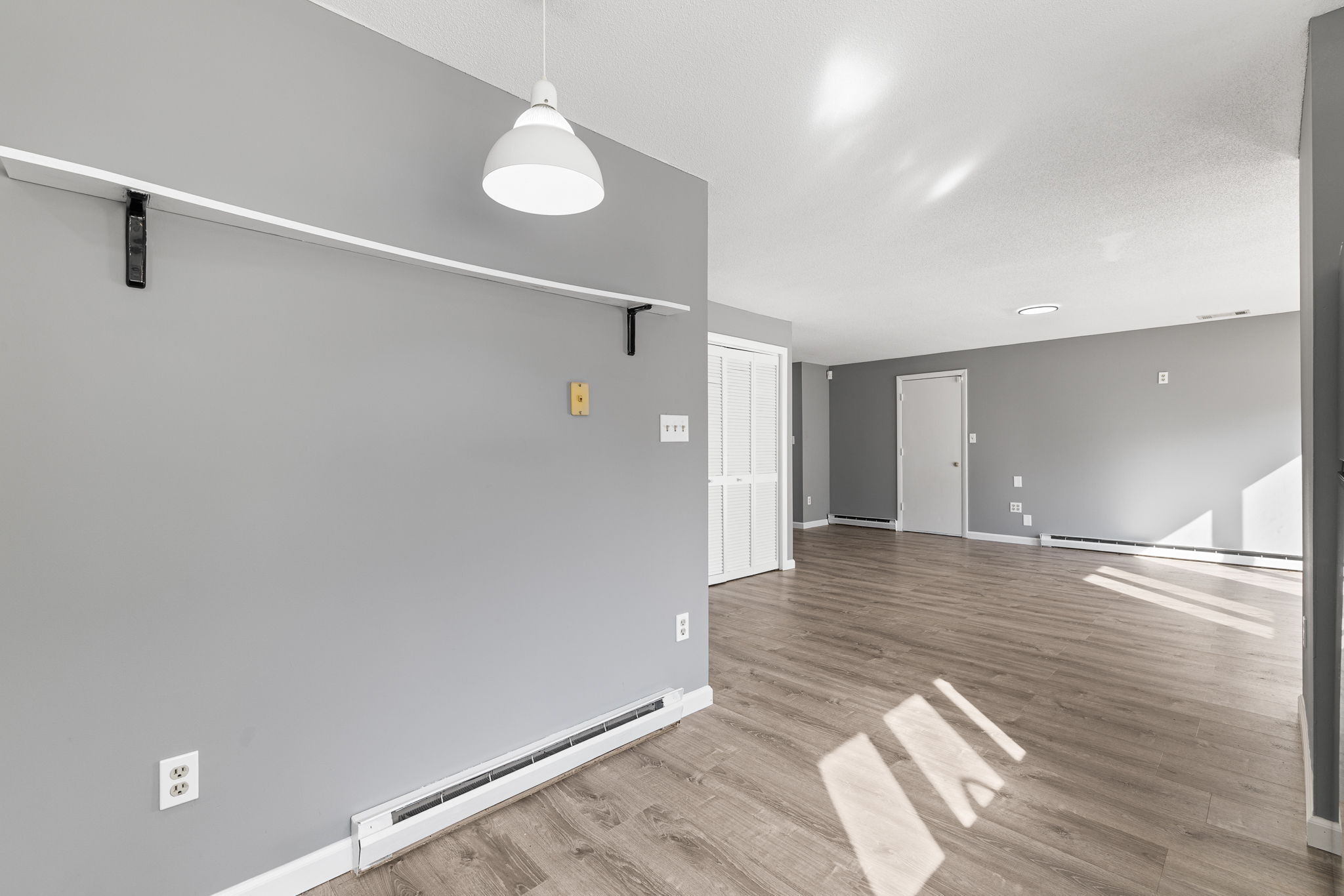 8 Burma Road Southbury, CT 06488 - Photo 10 of 23 a view of an empty room with wooden floor