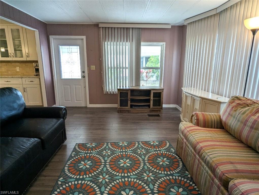 9269 Lord Road Bonita Springs, FL 34135 - Photo 10 of 20 a living room with furniture and a fireplace