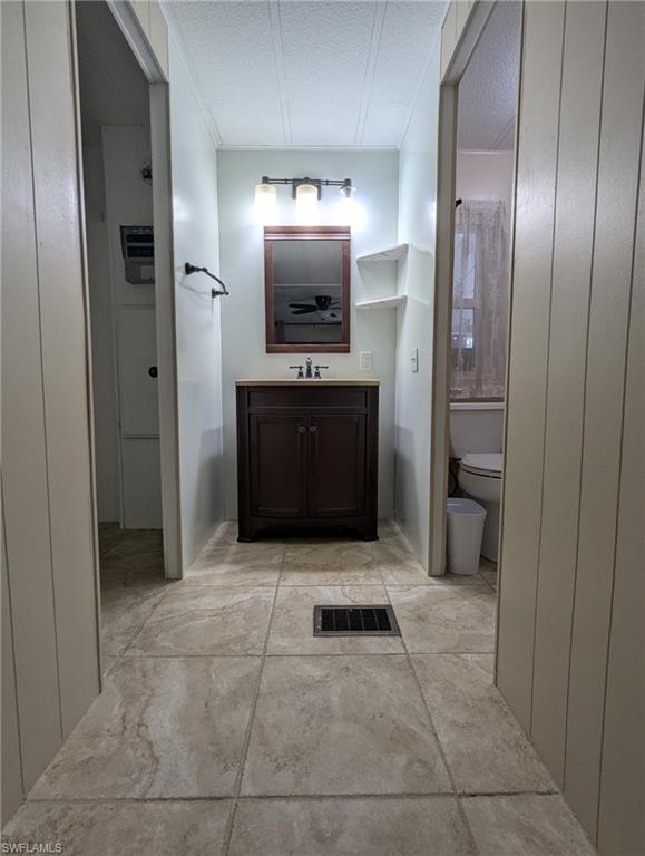 9269 Lord Road Bonita Springs, FL 34135 - Photo 15 of 20 a bathroom with a sink and a mirror