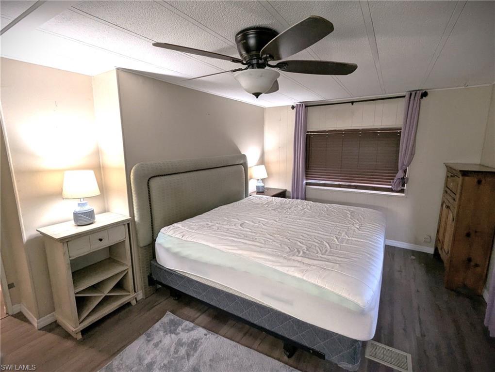 9269 Lord Road Bonita Springs, FL 34135 - Photo 18 of 20 a bedroom with a bed and a flat screen tv