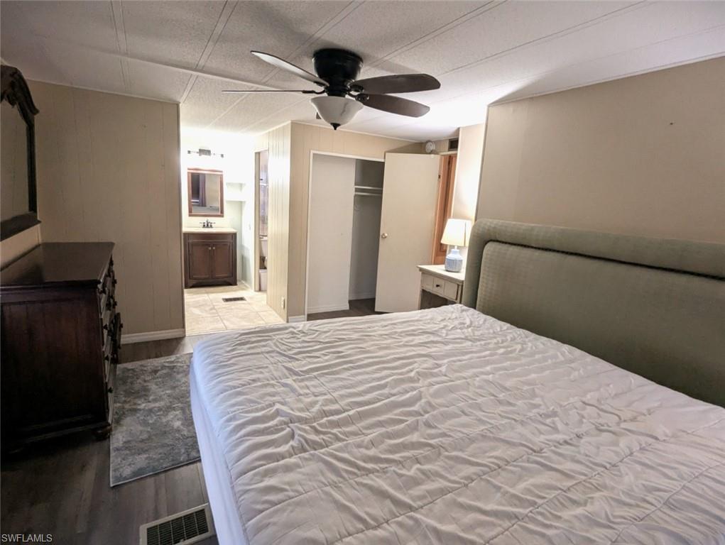 9269 Lord Road Bonita Springs, FL 34135 - Photo 19 of 20 a bedroom with a bed and a dresser