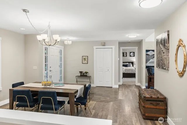 a view of a dining room with furniture and wooden floor