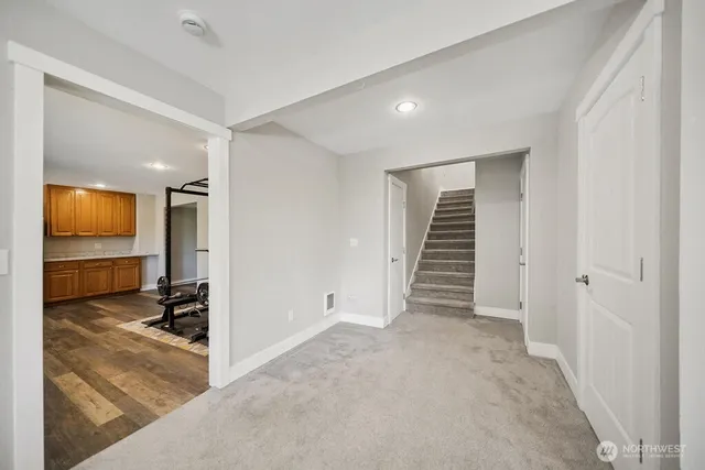 a view of a hallway view with staircase