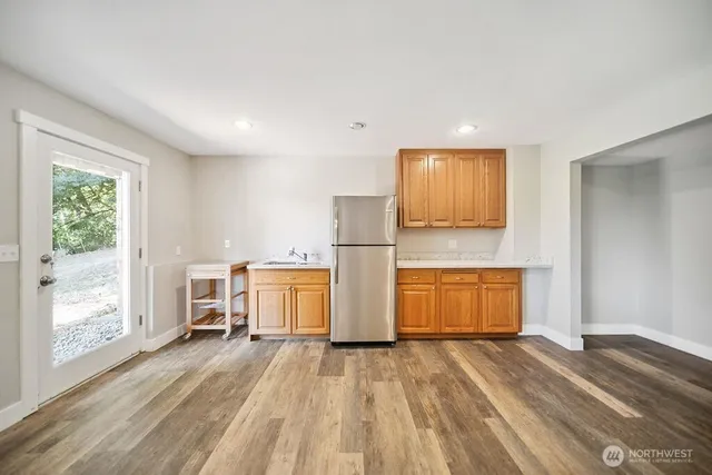 a view of kitchen and wooden floor