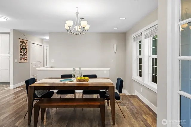 a view of a dining room with furniture and wooden floor