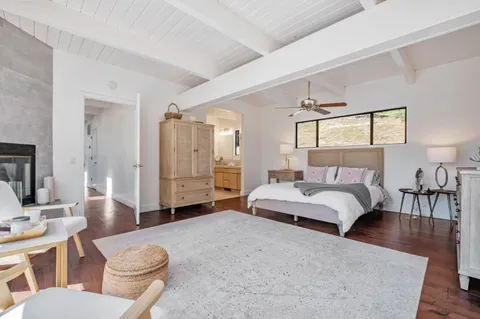 a bedroom with a bed and a couch