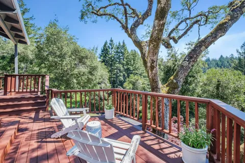 a view of a patio with wooden floor