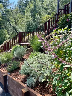 a view of street with wooden fence