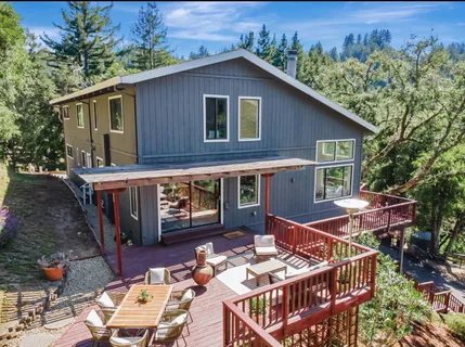 a view of a house with large windows